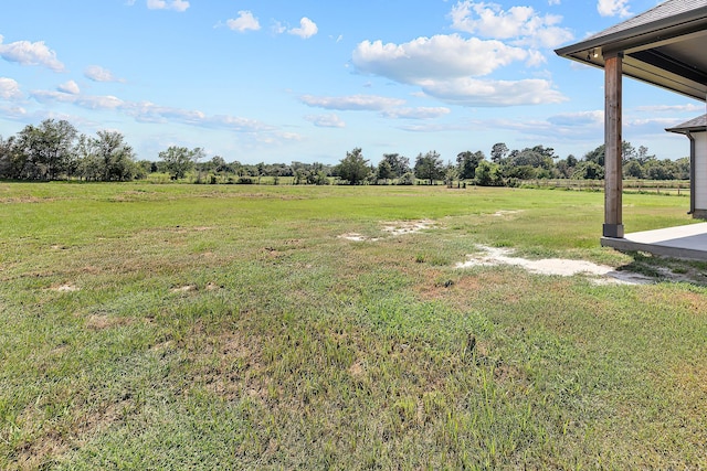 view of yard with a rural view