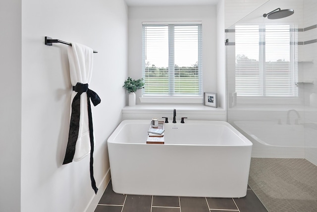 bathroom featuring tile patterned floors and independent shower and bath