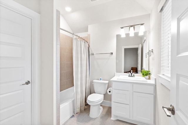 full bath featuring toilet, lofted ceiling, tile patterned flooring, shower / bath combo with shower curtain, and vanity