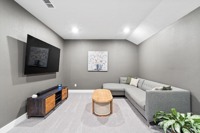 living area with carpet, visible vents, and baseboards