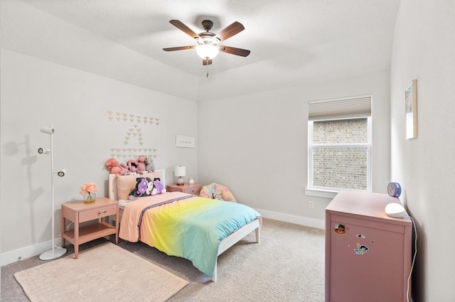 bedroom with light colored carpet, ceiling fan, and baseboards