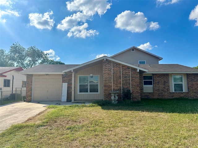 single story home with central air condition unit, a front lawn, and a garage