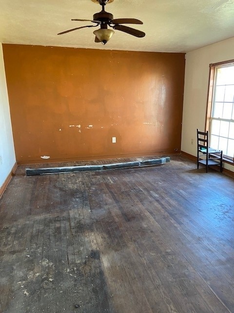 spare room featuring dark wood-type flooring