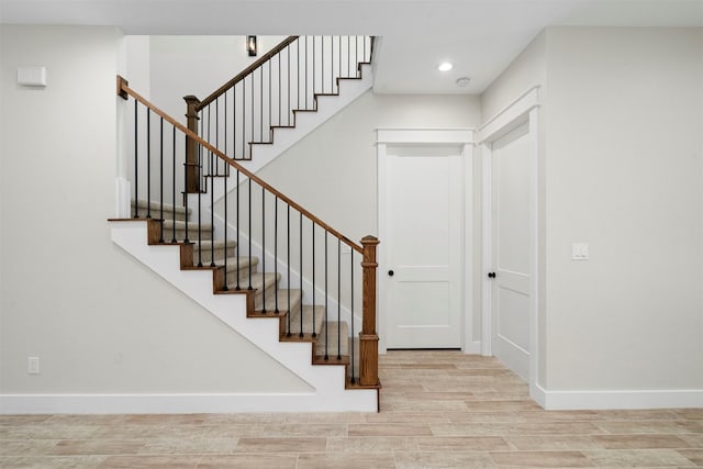 stairway featuring hardwood / wood-style floors