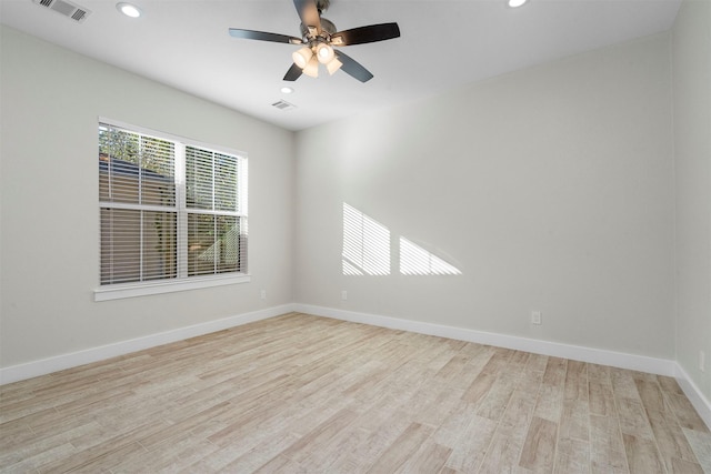 unfurnished room featuring ceiling fan and light wood-type flooring