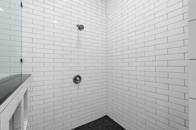 bathroom with a tile shower