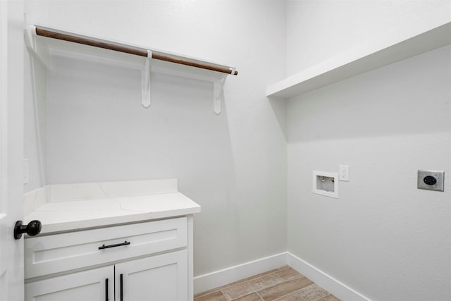 laundry room featuring washer hookup, light hardwood / wood-style floors, and electric dryer hookup