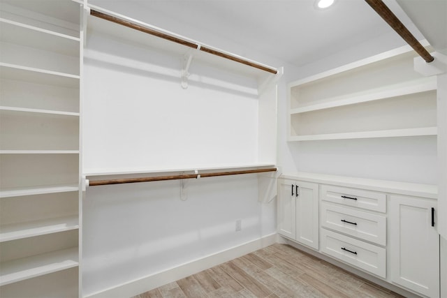 spacious closet featuring light wood-type flooring