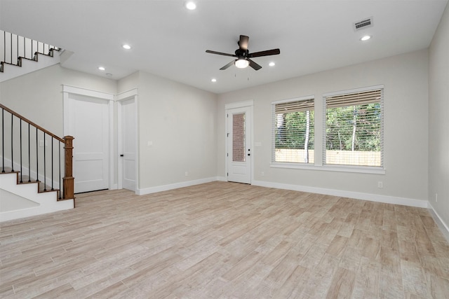 unfurnished living room featuring light wood-type flooring and ceiling fan