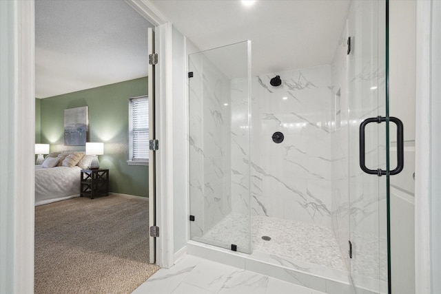 ensuite bathroom featuring marble finish floor, baseboards, a marble finish shower, and ensuite bathroom