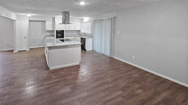 kitchen featuring white cabinets, sink, a textured ceiling, dark hardwood / wood-style flooring, and island exhaust hood