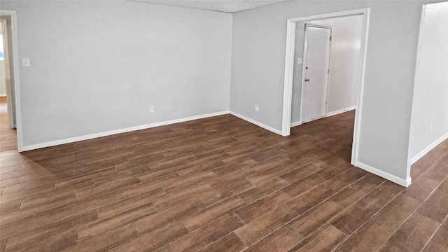 empty room featuring dark hardwood / wood-style floors