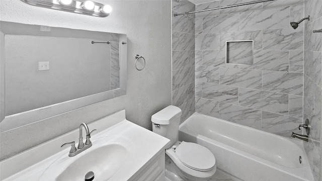 full bathroom with vanity, toilet, and tiled shower / bath