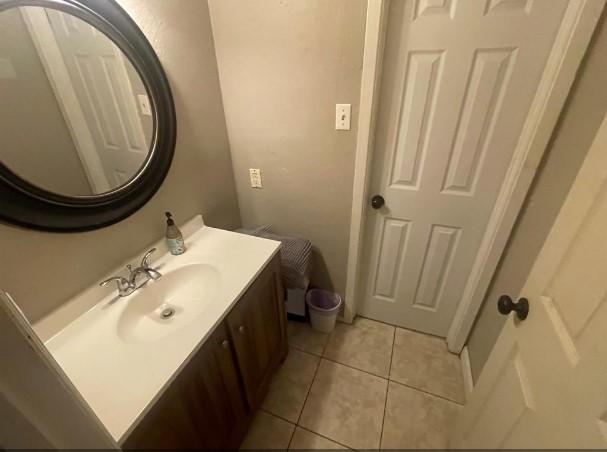 bathroom with vanity and tile patterned floors