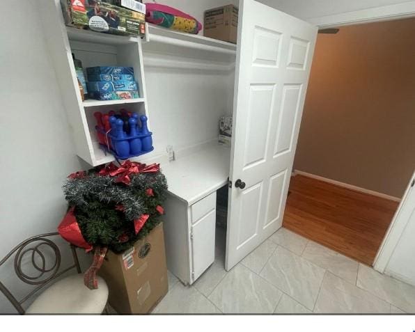 laundry room with light hardwood / wood-style floors