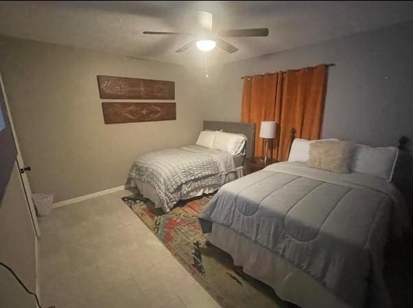 bedroom featuring ceiling fan and light colored carpet