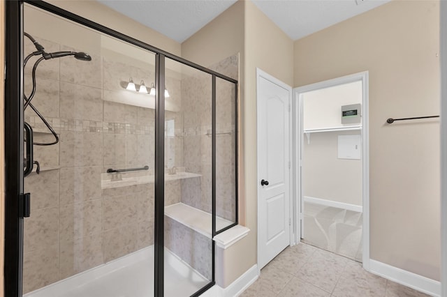 bathroom featuring tile patterned floors and an enclosed shower