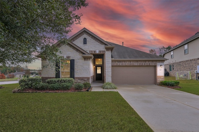 view of front of house with a lawn and a garage