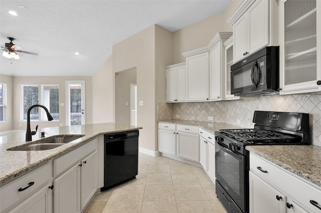 kitchen featuring white cabinets, sink, ceiling fan, and black appliances