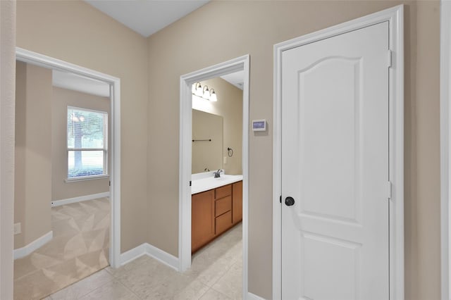 bathroom with tile patterned floors and vanity