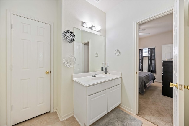 bathroom with tile patterned flooring and vanity