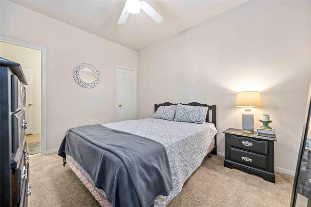 carpeted bedroom featuring ceiling fan