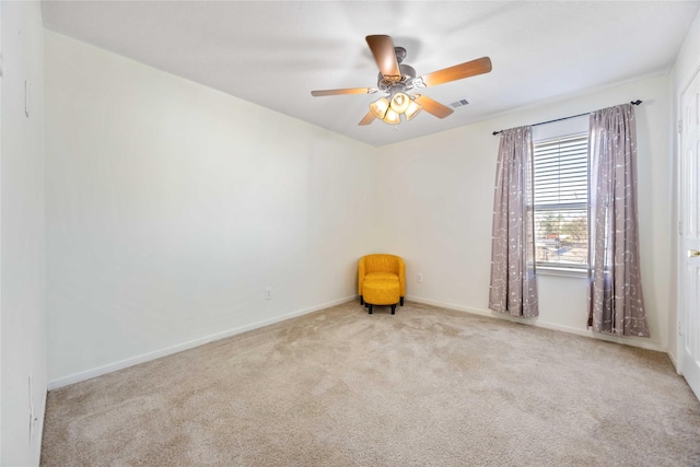 carpeted empty room with ceiling fan