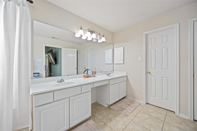 bathroom featuring tile patterned flooring and vanity