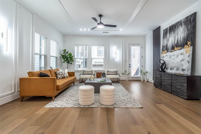 sitting room featuring ceiling fan and light wood-type flooring