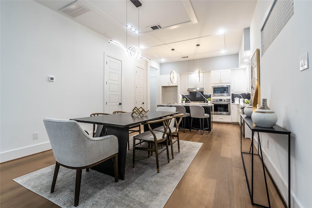 dining space featuring dark hardwood / wood-style floors