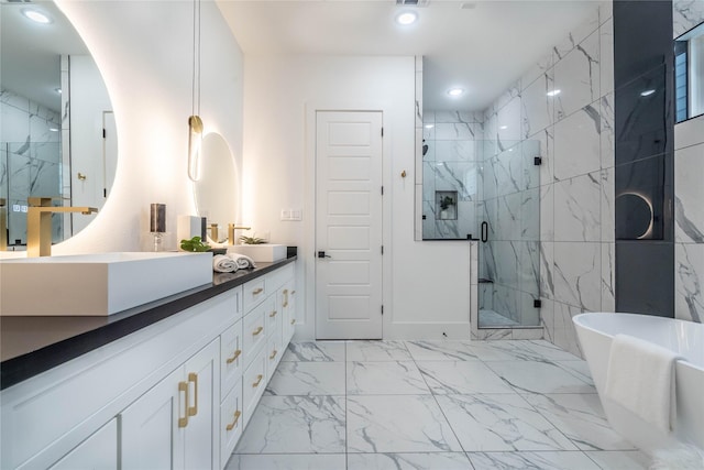 bathroom featuring separate shower and tub and vanity