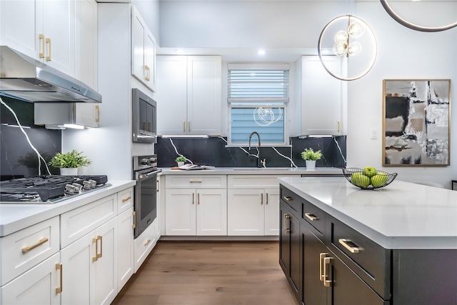 kitchen with sink, white cabinetry, and stainless steel appliances