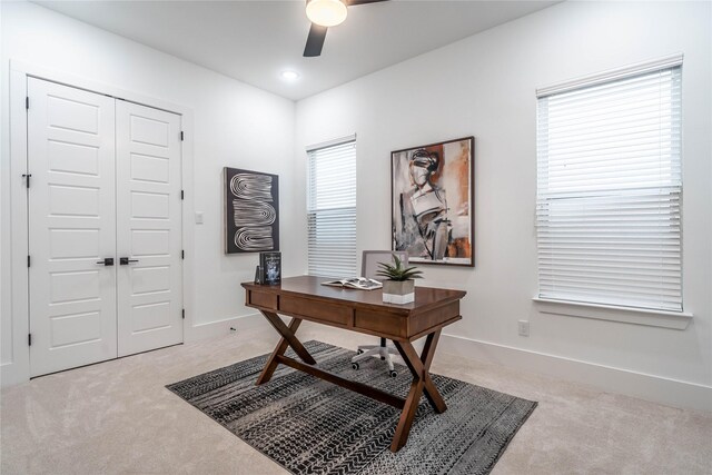 office area featuring light colored carpet and ceiling fan