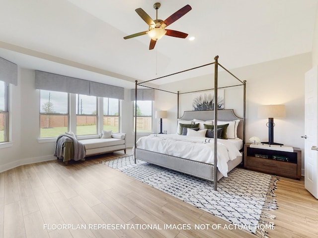 bedroom with light hardwood / wood-style floors and ceiling fan