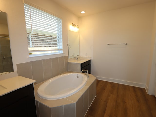8327 Oceanmist Cove Dr, Cypress, TX 77433 - full bathroom featuring a garden tub, wood finished floors, tiled shower, vanity, and recessed lighting