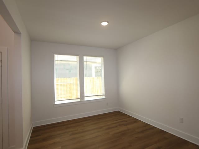 8327 Oceanmist Cove Dr, Cypress, TX 77433 - unfurnished room with baseboards, dark wood-type flooring, and recessed lighting