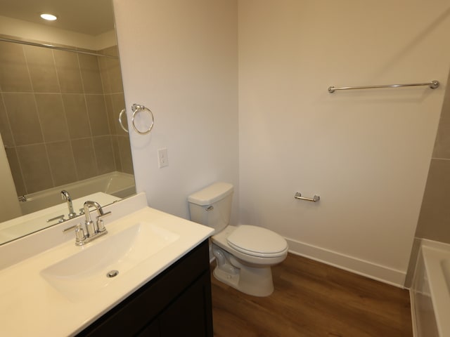 8327 Oceanmist Cove Dr, Cypress, TX 77433 - bathroom with vanity, toilet, baseboards, and wood finished floors