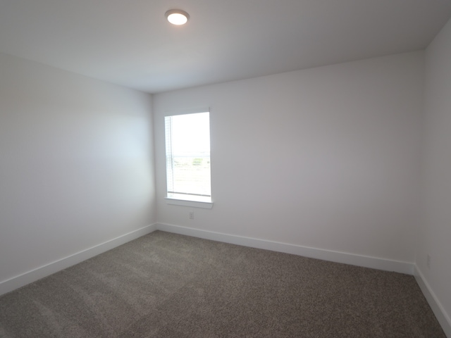 8327 Oceanmist Cove Dr, Cypress, TX 77433 - spare room with baseboards and light carpet