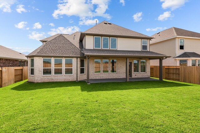 8327 Oceanmist Cove Dr, Cypress, TX 77433 - rear view of house featuring roof with shingles, a patio, and brick siding