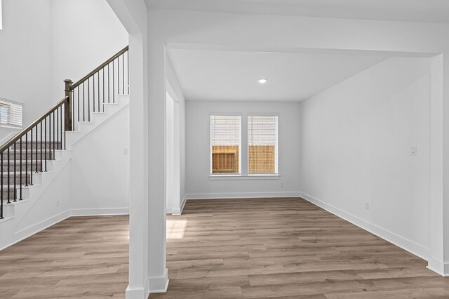 8327 Oceanmist Cove Dr, Cypress, TX 77433 - staircase featuring wood finished floors, baseboards, and recessed lighting