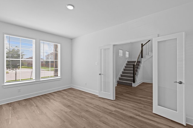 8327 Oceanmist Cove Dr, Cypress, TX 77433 - unfurnished room with stairs, wood finished floors, and baseboards