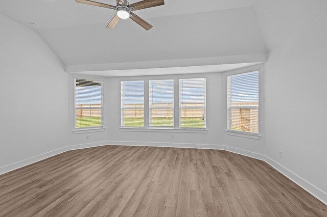 8327 Oceanmist Cove Dr, Cypress, TX 77433 - spare room with lofted ceiling, a ceiling fan, wood finished floors, and baseboards