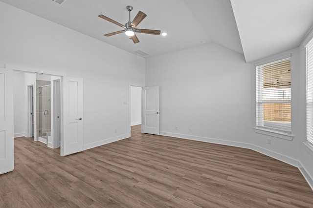 8327 Oceanmist Cove Dr, Cypress, TX 77433 - unfurnished bedroom featuring wood finished floors, baseboards, ceiling fan, and high vaulted ceiling