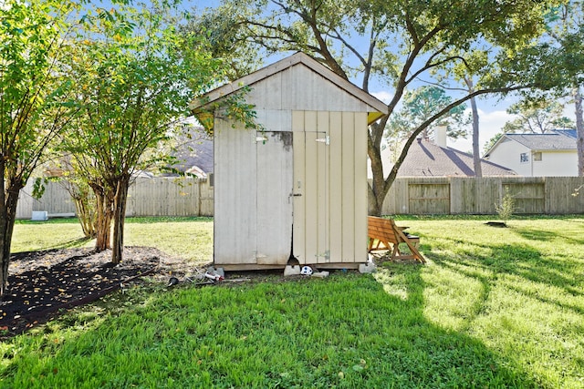 view of outdoor structure featuring a lawn