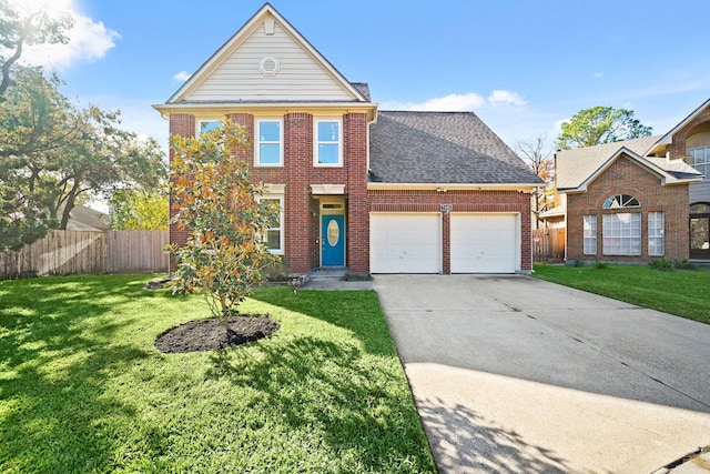 view of property featuring a garage and a front yard