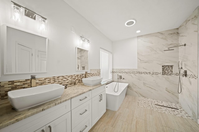 bathroom featuring vanity, tile walls, and plus walk in shower