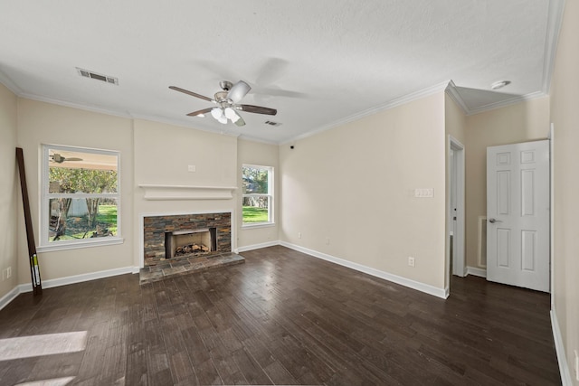 unfurnished living room with a stone fireplace, dark wood-type flooring, a textured ceiling, and ornamental molding