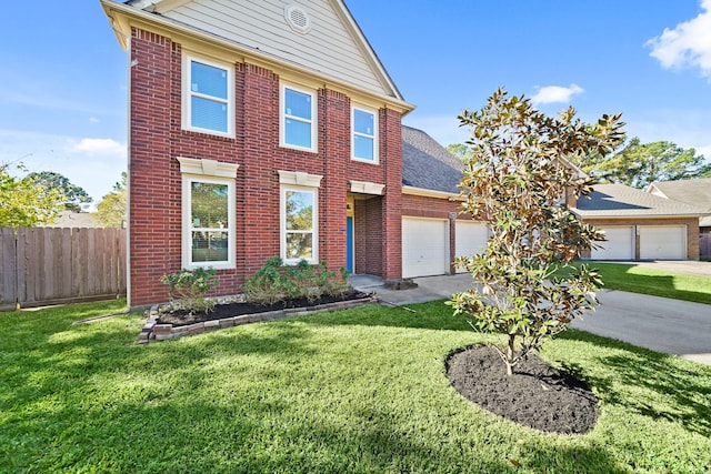 view of front of house featuring a garage and a front lawn