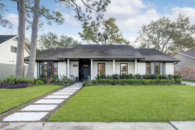 view of front of property with a front lawn