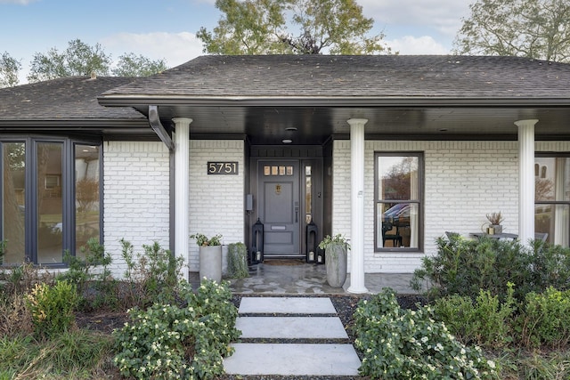 property entrance featuring covered porch